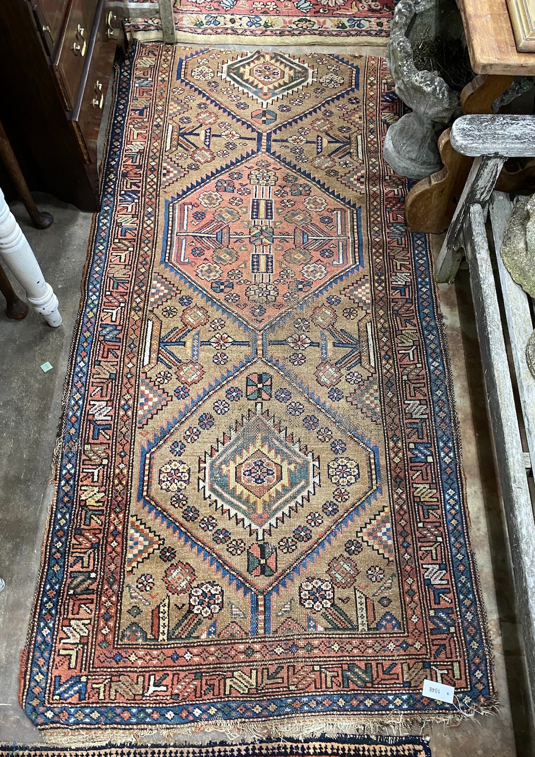 Two Caucasian rugs, red ground with central medallion, 198 x 134cm, the other 227 x 112cm